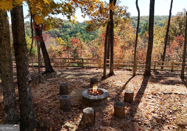 view of yard with an outdoor fire pit