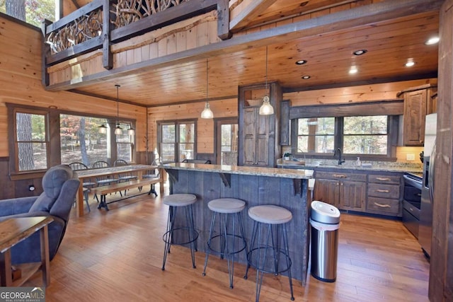 kitchen with a healthy amount of sunlight and light stone countertops