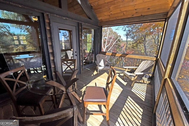 sunroom with wood ceiling and lofted ceiling