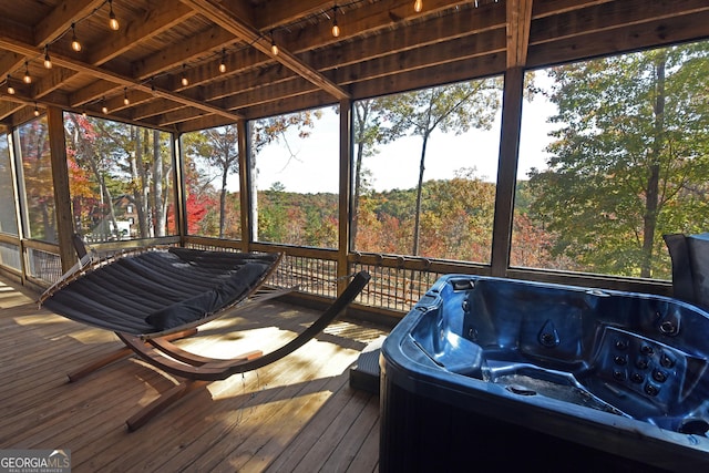 sunroom featuring wooden ceiling and a hot tub