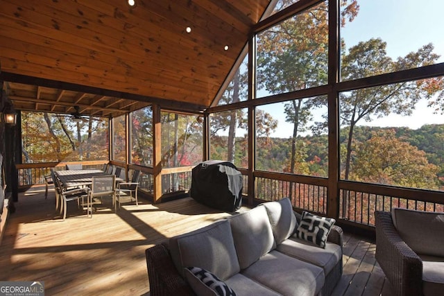 deck with a grill and an outdoor hangout area