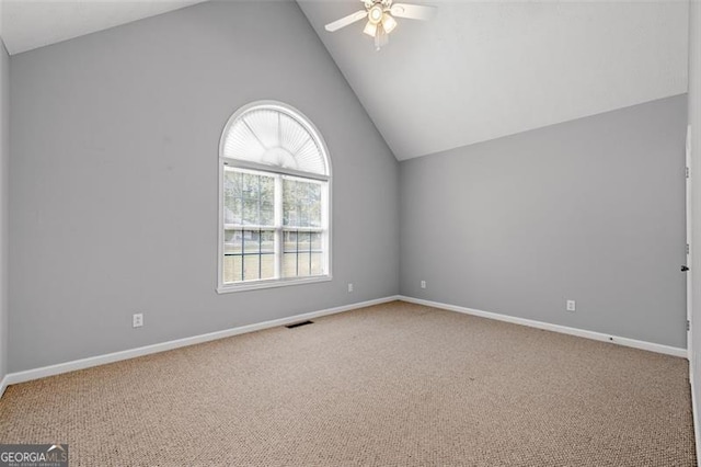 empty room with ceiling fan, carpet flooring, and a wealth of natural light