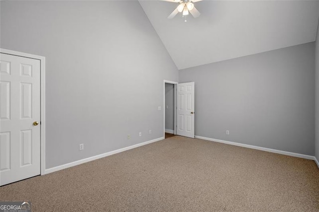 unfurnished bedroom featuring carpet floors, high vaulted ceiling, and ceiling fan