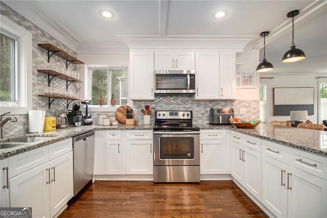 kitchen with white cabinetry, stainless steel appliances, and sink