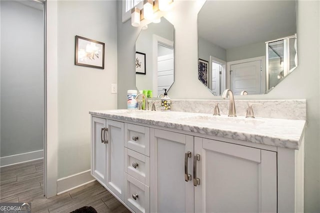 bathroom with vanity and hardwood / wood-style floors