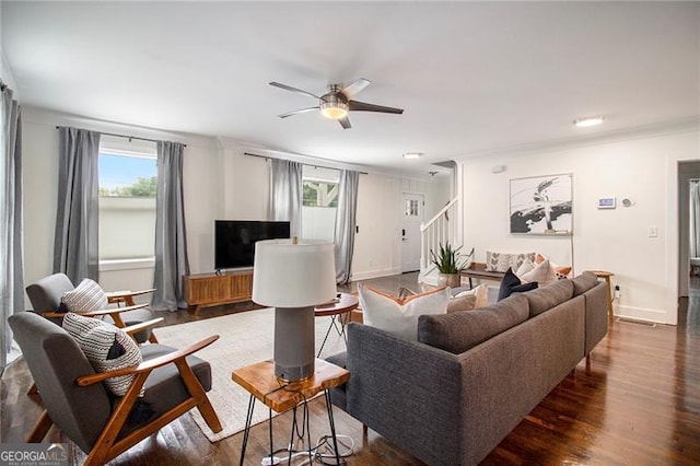 living room featuring dark hardwood / wood-style floors, a healthy amount of sunlight, and ceiling fan