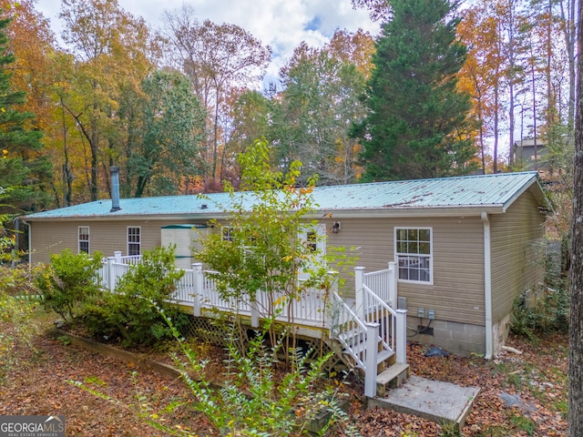 rear view of property with a deck