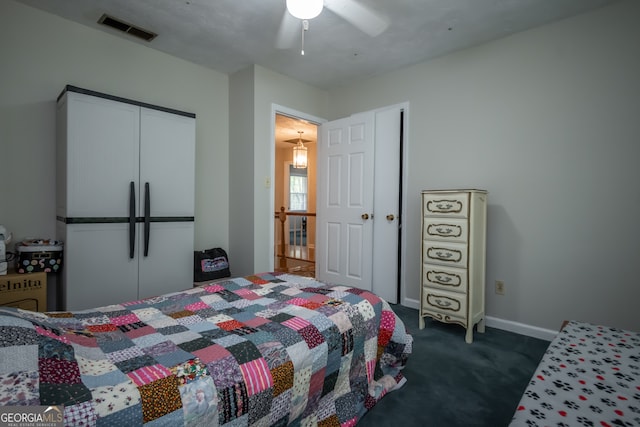 bedroom with dark colored carpet and ceiling fan