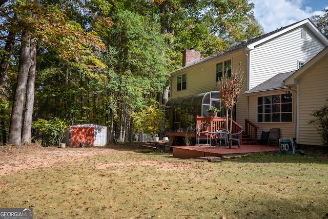 view of yard featuring a shed and a deck