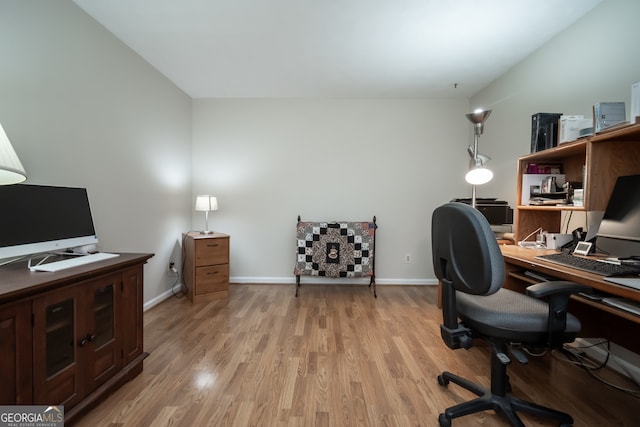 office space with light wood-type flooring