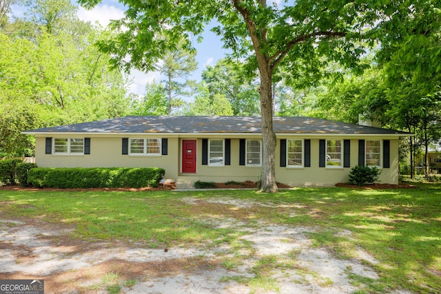 ranch-style home with a front lawn