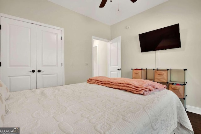 bedroom with a closet, ceiling fan, and dark wood-type flooring