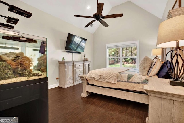 bedroom with dark wood-type flooring, ceiling fan, and high vaulted ceiling