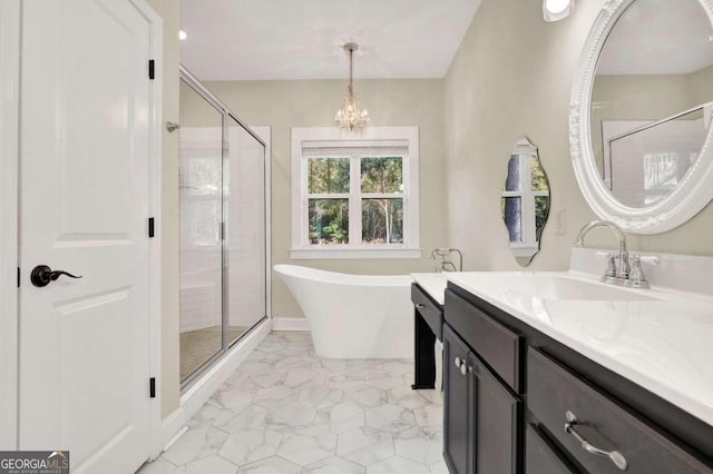 bathroom featuring vanity, a chandelier, and plus walk in shower