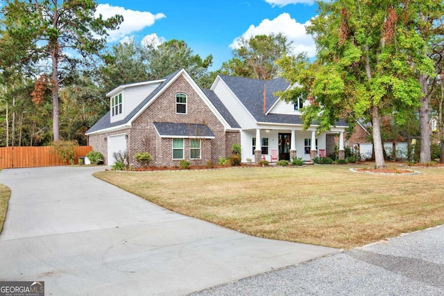 view of front facade with a front lawn and a porch