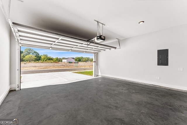 garage featuring a garage door opener and electric panel