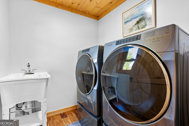 laundry room with wood-type flooring, wood ceiling, and independent washer and dryer