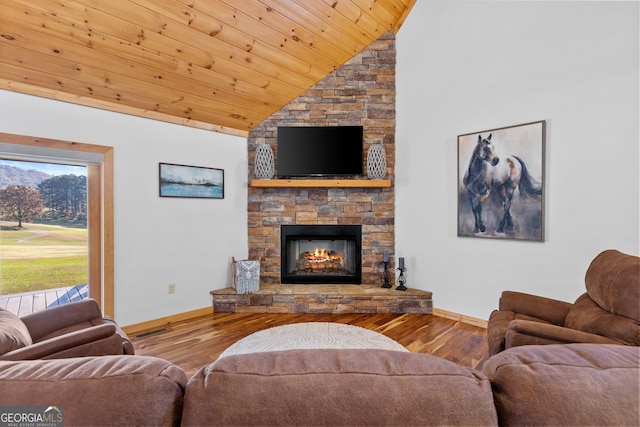 living room with wood-type flooring, high vaulted ceiling, a stone fireplace, and wooden ceiling