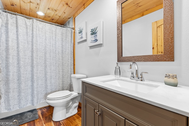 bathroom with hardwood / wood-style floors, vanity, toilet, and wooden ceiling