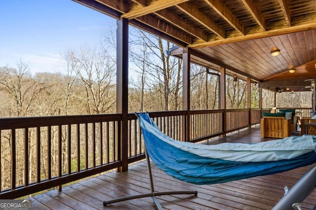 wooden terrace featuring ceiling fan