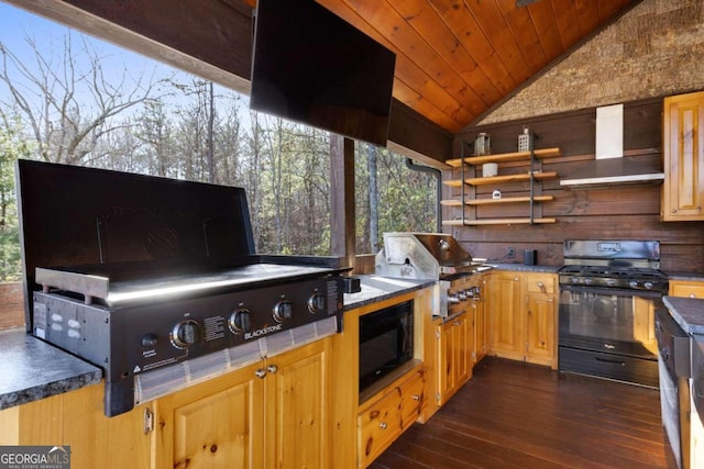 view of patio with area for grilling and a deck