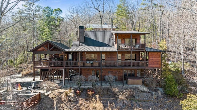 back of house with a balcony