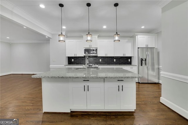 kitchen with dark hardwood / wood-style floors, white cabinetry, light stone countertops, an island with sink, and stainless steel appliances