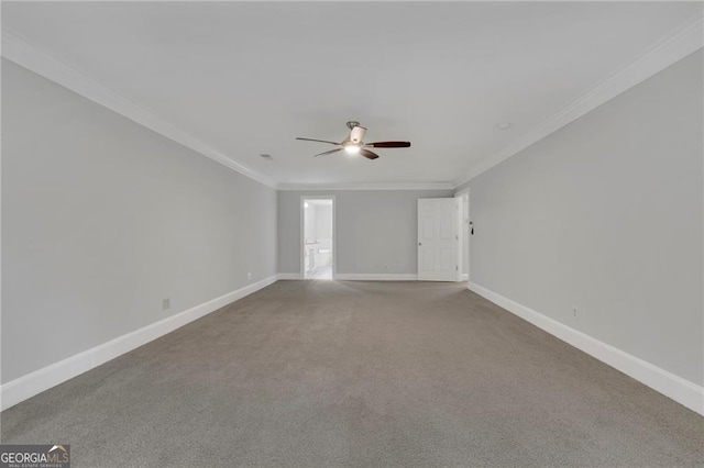 empty room with ceiling fan, ornamental molding, and carpet flooring