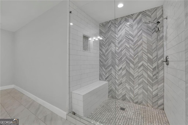 bathroom featuring a tile shower