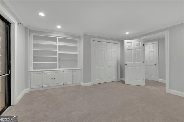 unfurnished bedroom with light colored carpet