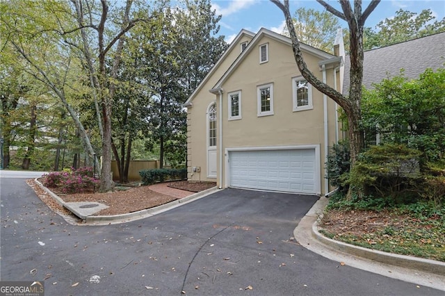 view of property exterior with a garage