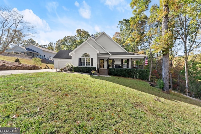 view of front of home with covered porch and a front yard