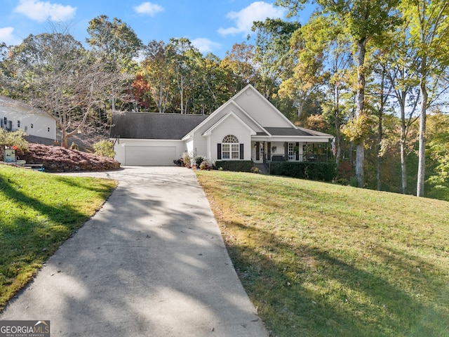 ranch-style house featuring a porch, a front yard, and a garage