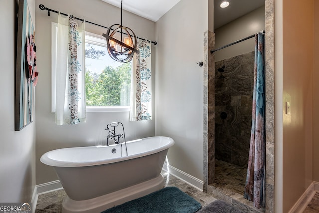 bathroom featuring separate shower and tub