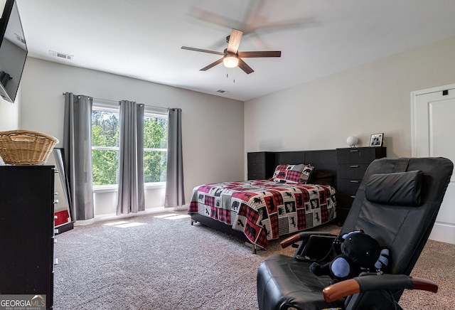 bedroom with ceiling fan and carpet