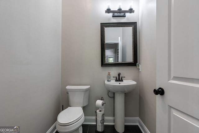 bathroom with sink and toilet