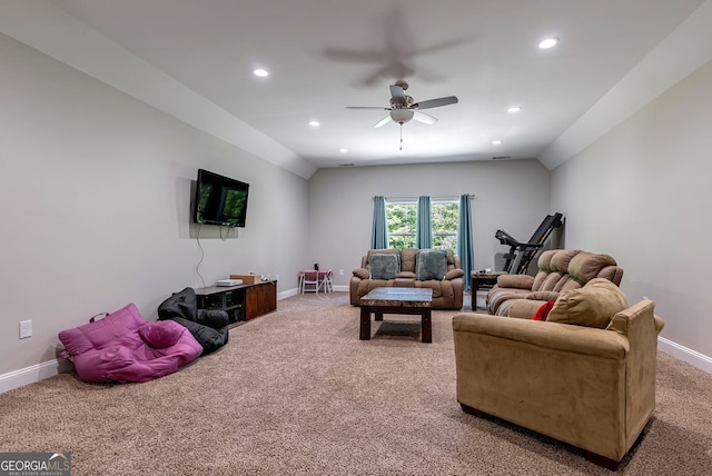 carpeted living room featuring vaulted ceiling and ceiling fan