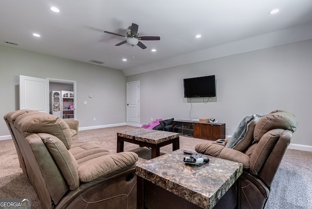 living room with ceiling fan and carpet