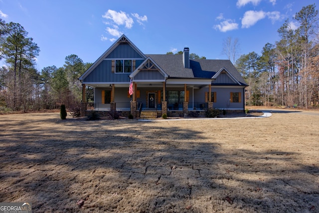 craftsman-style house featuring a front yard and a porch