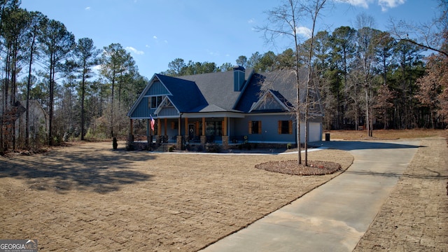 view of front of property with a garage and a porch