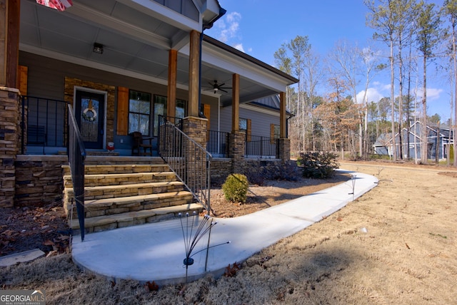 entrance to property featuring a porch and ceiling fan