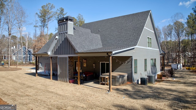 back of property featuring central AC and a patio area