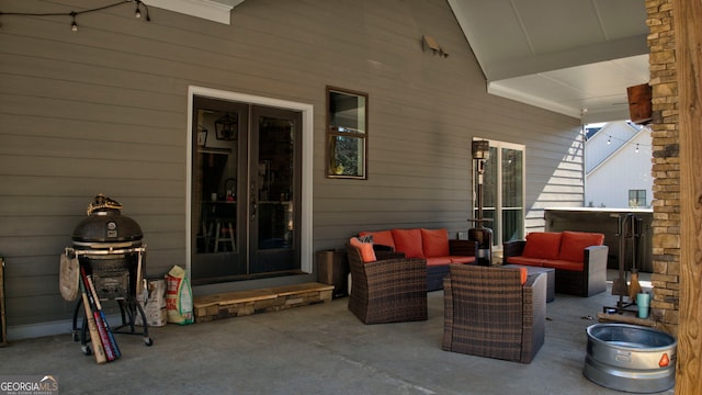 view of patio featuring an outdoor living space and a grill