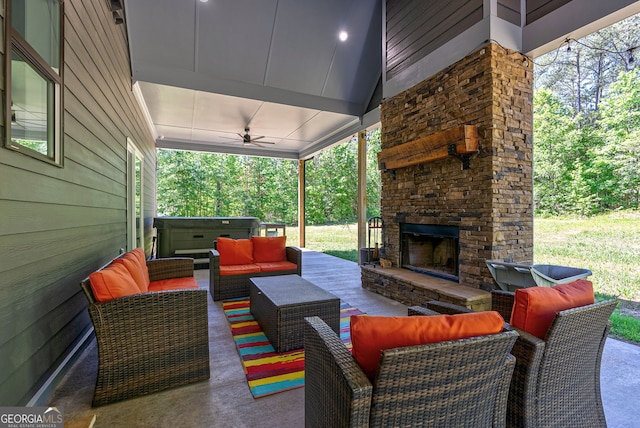 view of patio featuring an outdoor living space with a fireplace