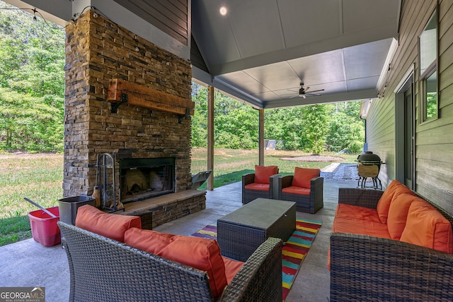 view of patio / terrace featuring an outdoor living space with a fireplace