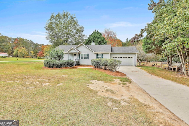 ranch-style house with a garage and a front lawn