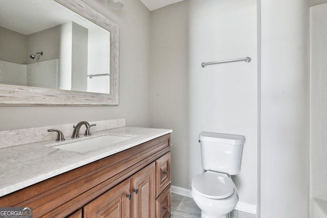 bathroom with toilet, vanity, a shower, and tile patterned floors