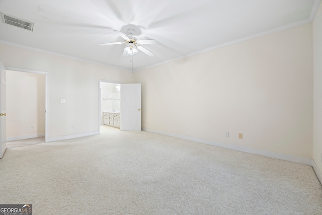 spare room with light carpet, crown molding, and ceiling fan