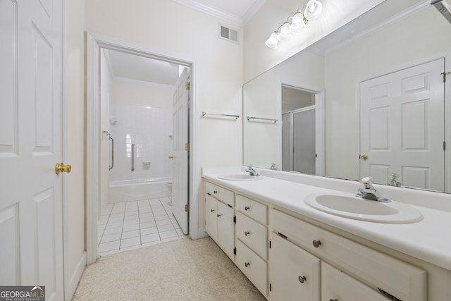 bathroom featuring vanity, ornamental molding, bath / shower combo with glass door, and tile patterned flooring