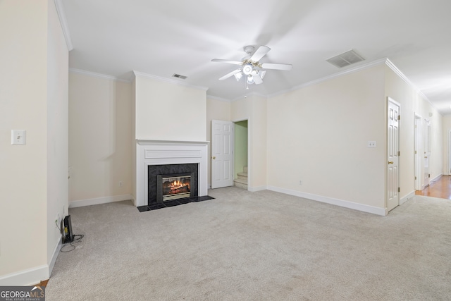 unfurnished living room with crown molding, light carpet, and ceiling fan